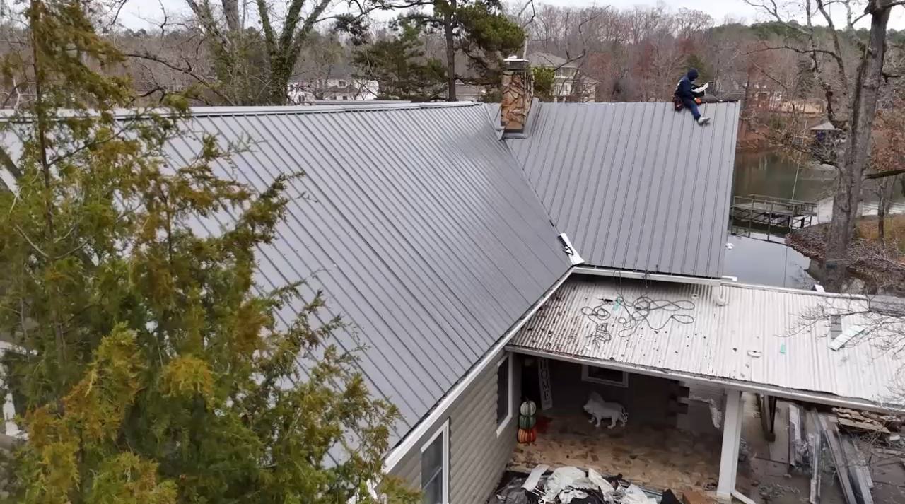 Metal roofing contractors from Triumph Roofing installing standing seam metal roof in Charlotte NC