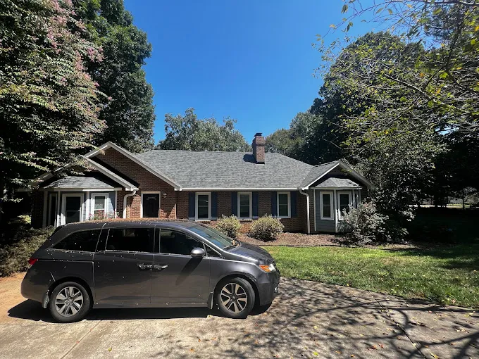 Experienced Triumph Roofing professionals conducting a thorough roof inspection in Kannapolis, NC