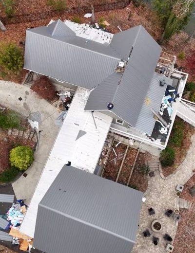 Standing seam metal roofing installation on Charlotte NC home by Triumph Roofing contractors